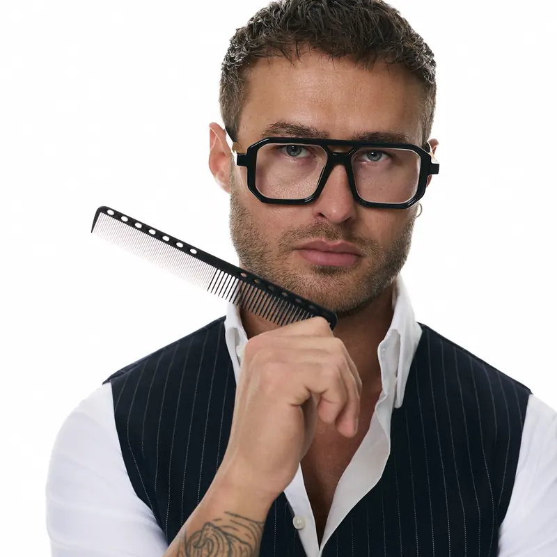 Dawid Krynicki in a pinstripe waistcoat, with a comb by his face
